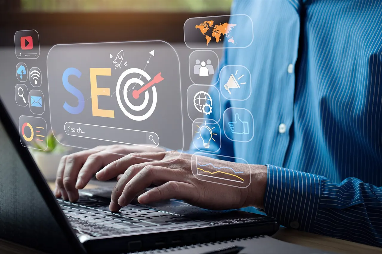Hands typing on a laptop beneath an illustrative SEO interface overlay