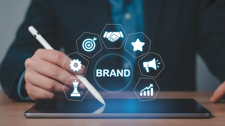 Hand using a stylus beside symbols for brand planning and market direction