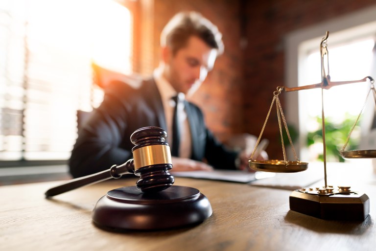 Gavel and scales of justice in a law firm's office